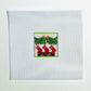 Cross-stitched design of stockings hanging by a fireplace on white fabric.