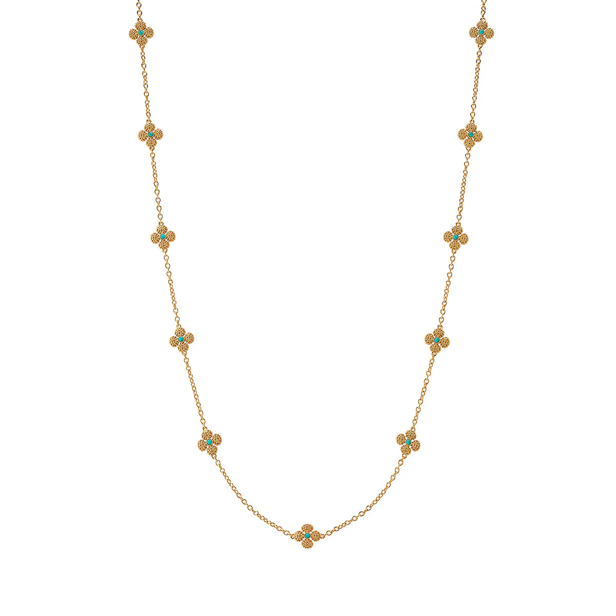 Gold necklace with turquoise stones on a white background