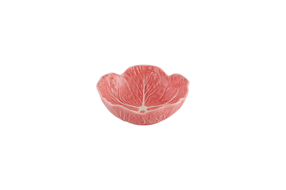 Pink ceramic bowl shaped like a cabbage leaf on a white background