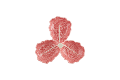 Pink ceramic leaf-shaped dish on a white background