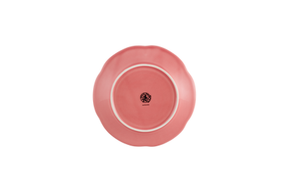 Pink ceramic plate with a logo on a white background
