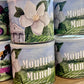 Cans of Moultrie Munch cat food with a floral design on the label.