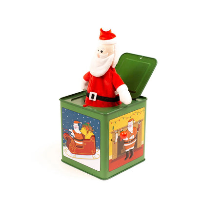 A green jack-in-the-box tin with Santa Claus popping out of the open top. The tin features holiday illustrations on the sides and a green lid.