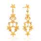 Gold floral earrings on a white background