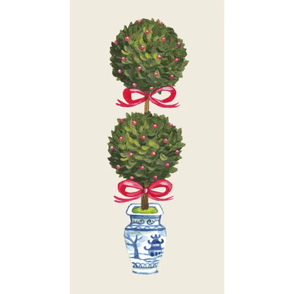 Decorative topiary with red ribbons in a blue and white vase on a beige background