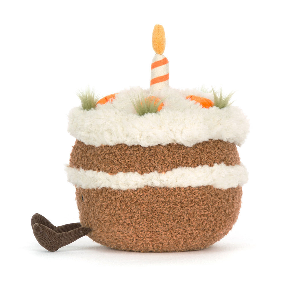 Toy resembling a birthday cake with candles on a white background