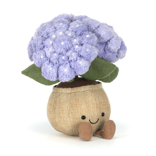 Plush toy resembling a cauliflower with a smiling face on a white background