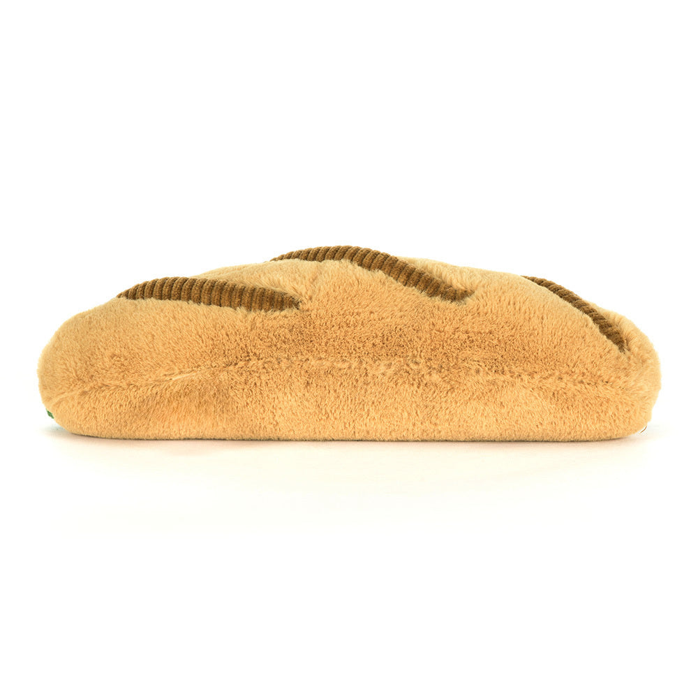 Tan slipper with brown interior on a white background