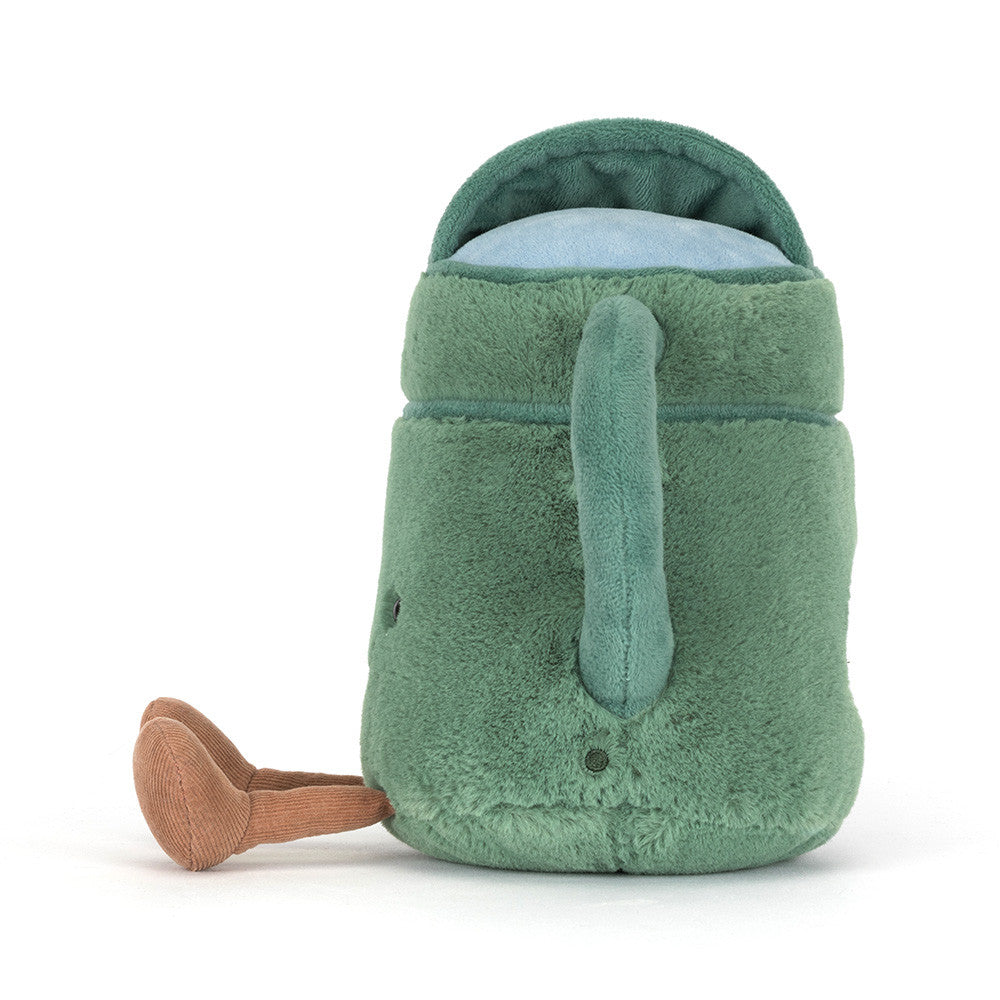 Green plush toy resembling a mug with a handle on a white background