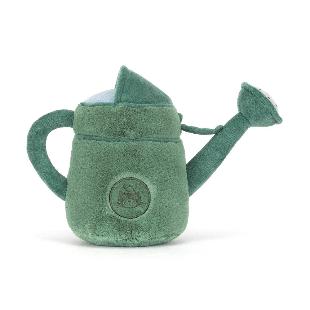 Green plush watering can toy on a white background