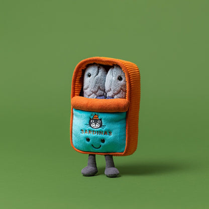 Plush toy resembling a smartphone with two small plush animals inside on a green background