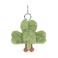 Green plush shamrock keychain on a white background