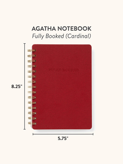 A red spiral-bound notebook shown on a light beige background with text reading 'AGATHA NOTEBOOK' and 'Fully Booked (Cardinal)'. Dimension lines indicate 8.