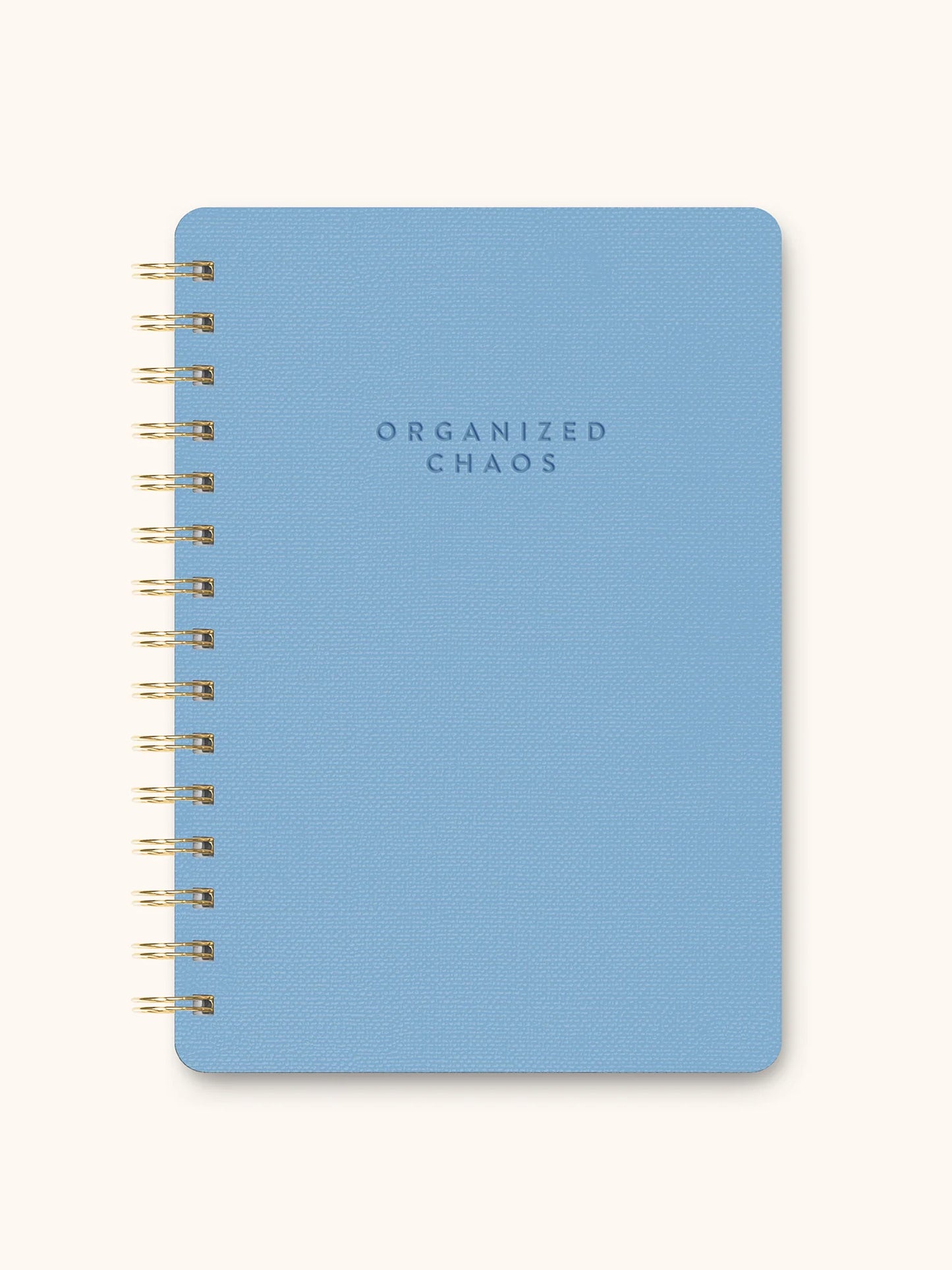 Blue notebook with 'ORGANIZED CHAOS' text on a white background