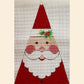 Decorative gnome with a red hat and white beard on a textured background