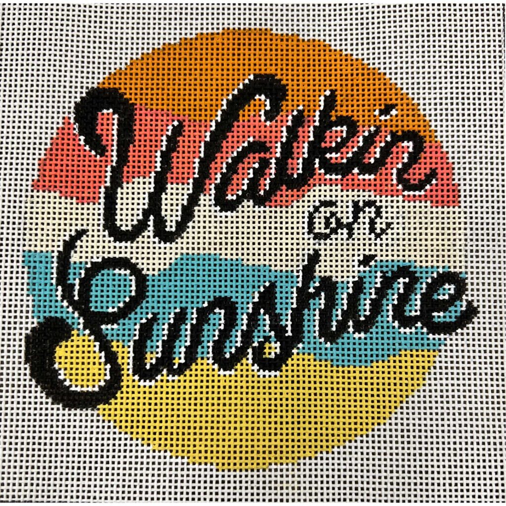 Cross-stitched design with 'Wakein for Sunshine' text on a grid background