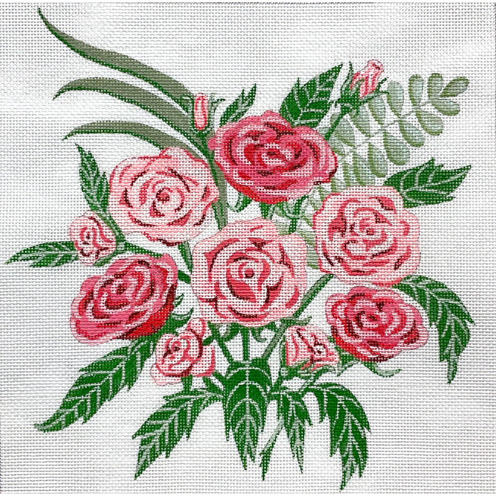 Embroidered design of pink roses with green leaves on a white background