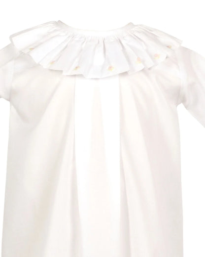 White blouse with ruffled collar on a white background