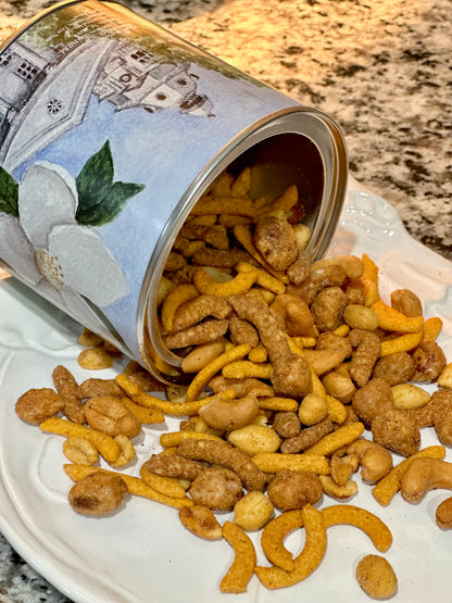 Open can of pet treats spilling onto a white plate with a marble countertop background