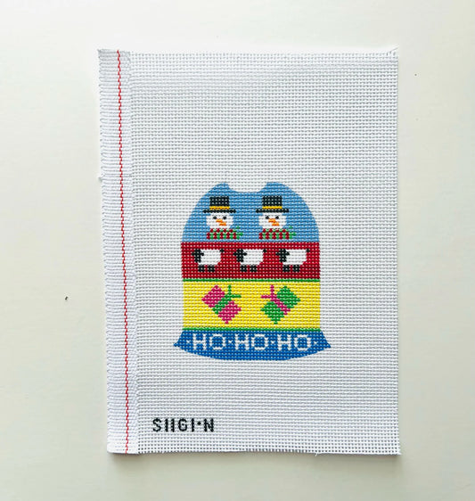A square white needlepoint canvas featuring a colorful Christmas train design with snowmen and the text 'HO-HO-HO' 
