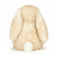Plush toy resembling a rabbit with long ears on a white background