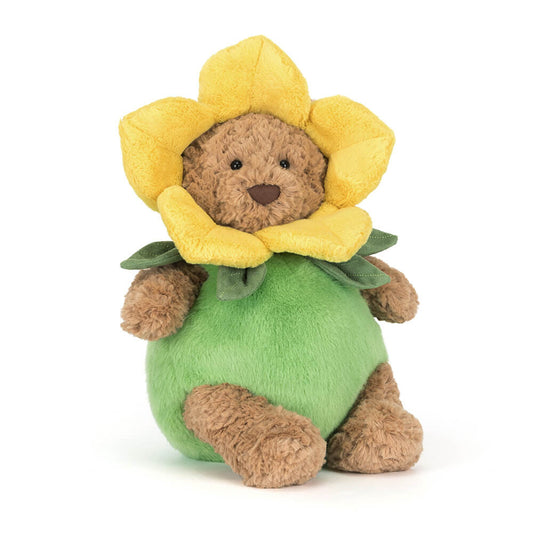 Plush toy bear with a yellow flower on a white background