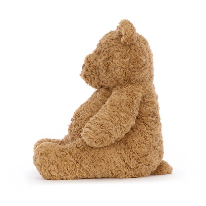 A medium-sized plush toy bear with a brown color and a soft, fluffy texture. It has a round face with a small nose and eyes, and is sitting upright.