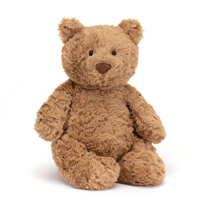 A medium-sized plush toy bear with a brown color and a soft, fluffy texture. It has a round face with a small nose and eyes, and is sitting upright.