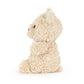 Fluffy beige plush toy on a white background