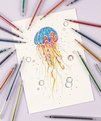 Colorful jellyfish illustration on paper surrounded by colored pencils.