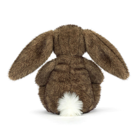 Brown plush bunny toy on a white background