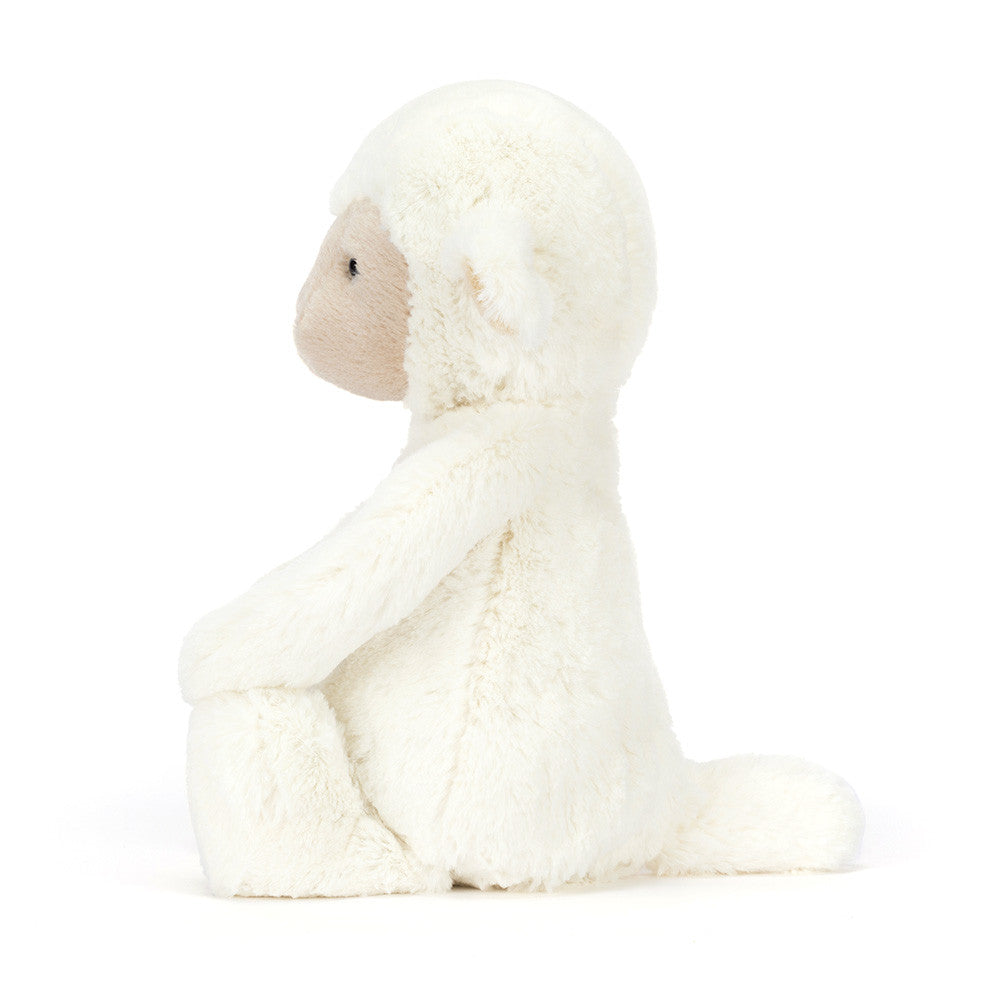 White plush toy sheep on a white background