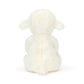White plush lamb toy on a white background