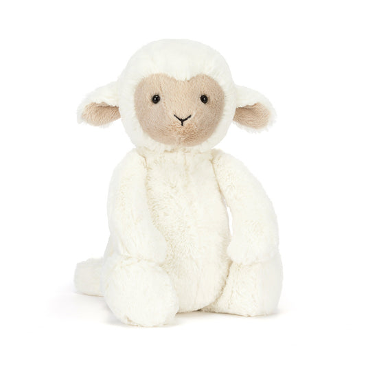lamb plush toy on a white background