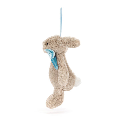 Plush bunny toy with blue bow tie on a white background