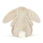 Fluffy beige bunny plush toy on a white background
