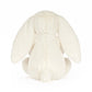 White plush bunny toy on a white background