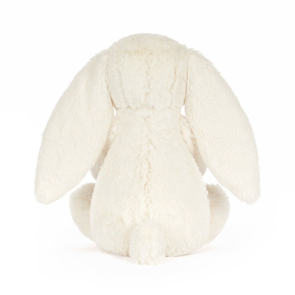 White plush bunny toy on a white background