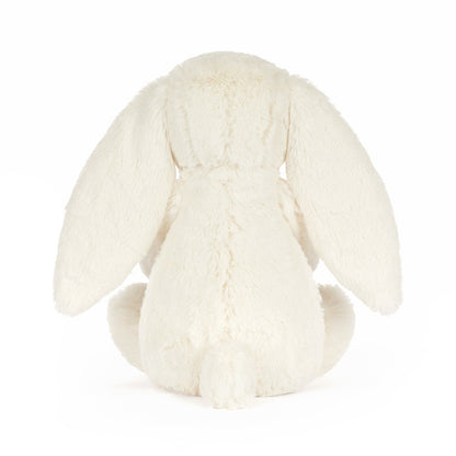 White plush bunny toy on a white background