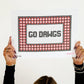 Person holding a sign with 'GO DAWGS' text and red checkered border.