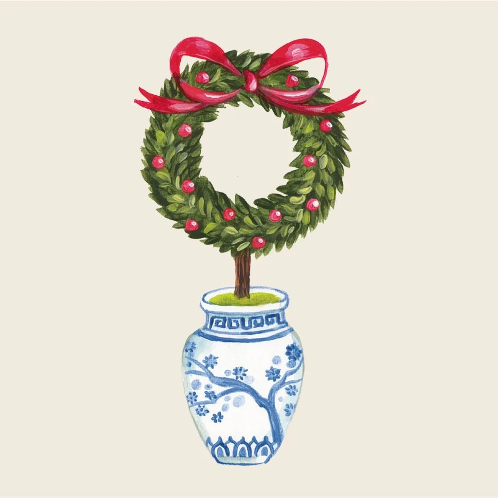 Topiary in a decorative pot with a red ribbon on a beige background