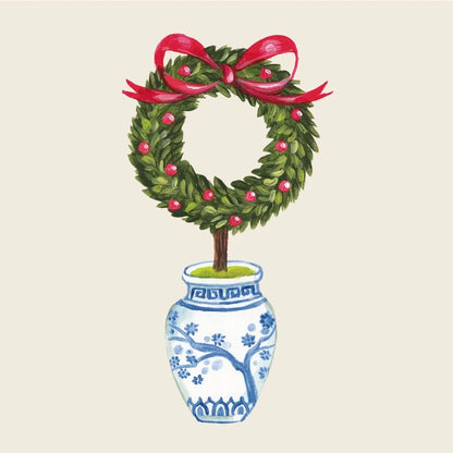 Topiary in a decorative pot with a red ribbon on a beige background