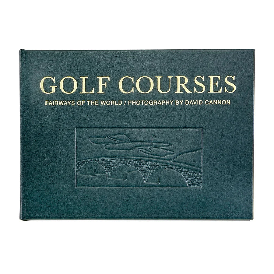 A hardcover book titled 'GOLF COURSES: FAIRWAYS OF THE WORLD / PHOTOGRAPHY BY DAVID CANNON' in gold lettering on a dark teal-green cover, shown against a plain white background.