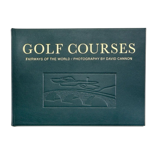 A hardcover book titled 'GOLF COURSES: FAIRWAYS OF THE WORLD / PHOTOGRAPHY BY DAVID CANNON' in gold lettering on a dark teal-green cover, shown against a plain white background.