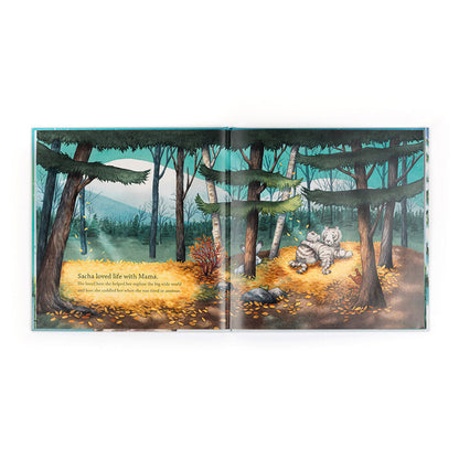 Illustrated book page with a forest scene and a tiger lying on the ground.