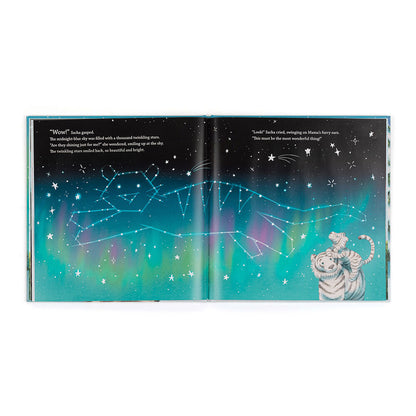 Open book showing a starry night sky illustration with a tiger character on a white background