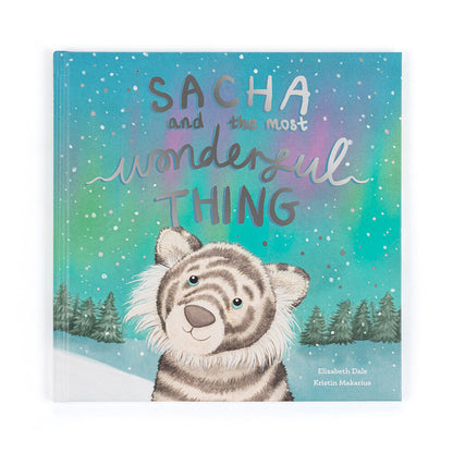 Book cover with a tiger illustration and text 'Sacha and the most wonderful thing' on a snowy background