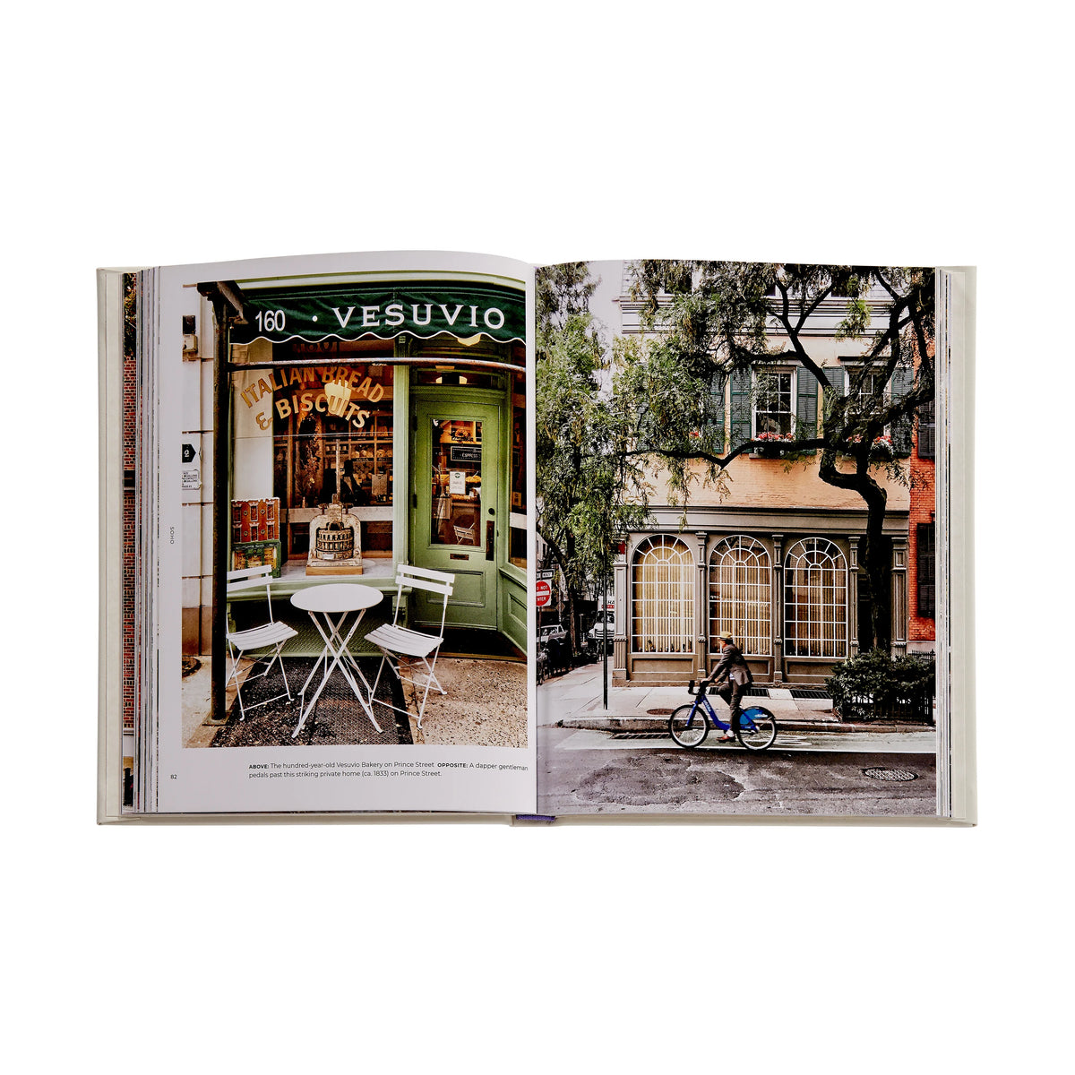 Open book showing two photographs: one of a green storefront and the other of a street scene with a cyclist.