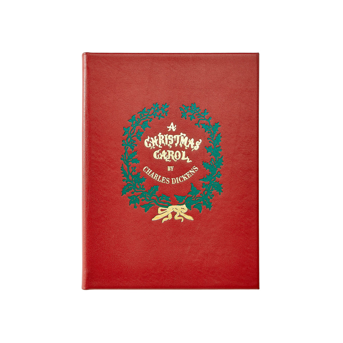 A red hardcover book featuring a green holly wreath and gold foil lettering that reads 'A Christmas Carol by Charles Dickens' on the front cover, shown against a plain white background.