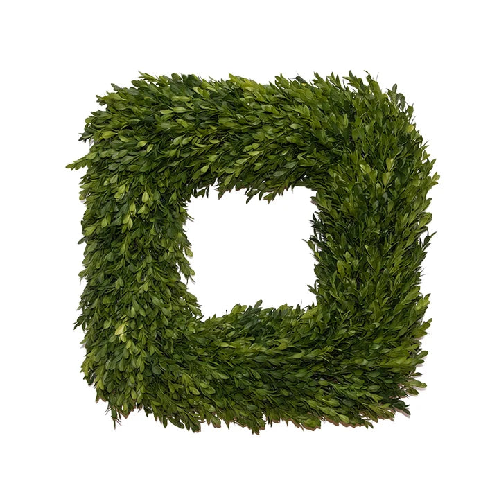 Square artificial boxwood wreath on a white background